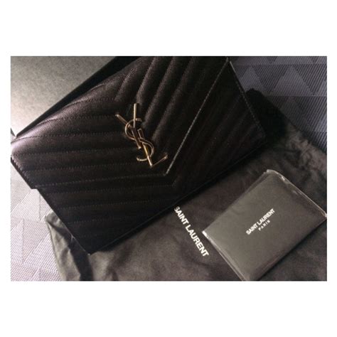 ysl clutch bag men|YSL clutch bag with tassel.